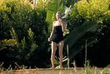 Kate Moss - Candids Wearing a Black Swimsuit